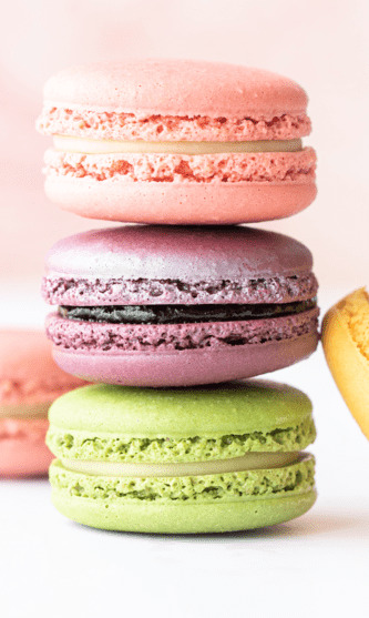A stack of colorful French macarons