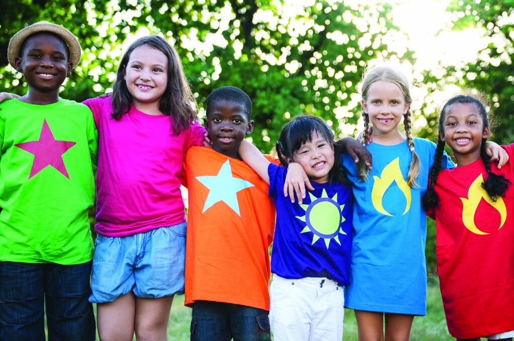 Group of happy children wearing custom-designed t-shirts
