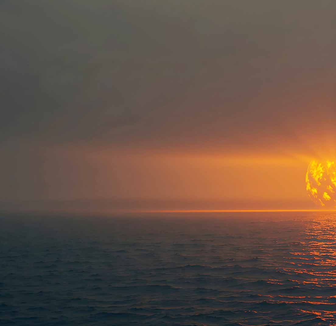 Nuclear explosion over the ocean at sunset — fiery orange blast on the horizon reflecting on the sea