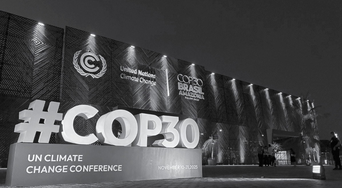 COP30 signage and UN Climate Change Conference venue at night