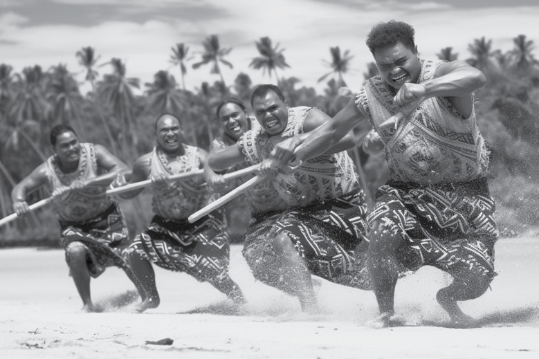 Tokelauan men paddling an outrigger canoe on the beach, running through shallow water