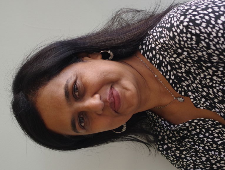 Portrait of Jaynashree Ellary smiling.