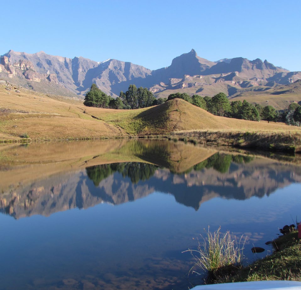 The Drakensberg Amphitheatre reflected in still water