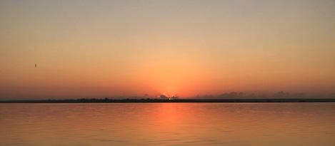 Sunset over the ocean illustrating natural light spectrum