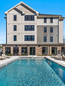 The resort-style outdoor pool deck at Vesa Apartments