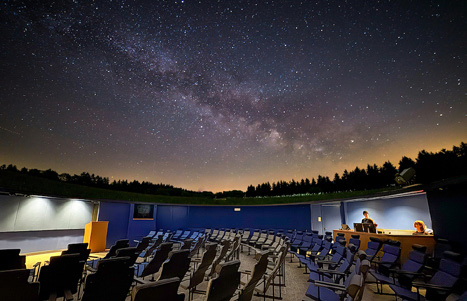 Interior view of the planetarium with seating and dome