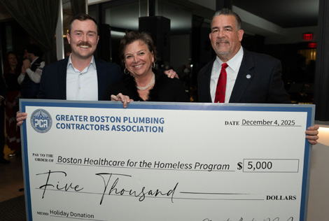 Greater Boston PCA representatives presenting a check to Boston Healthcare for the Homeless Program