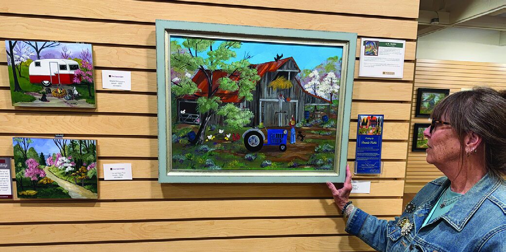 Amanda Mathis with her artwork