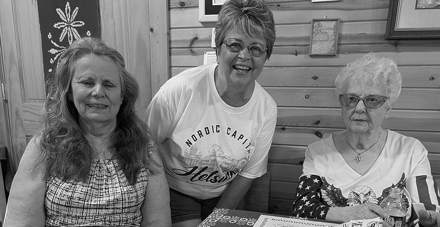 Carol Mead, Becky Dunne and Ruth Ann Falcione smiling together at the Finnish American Cultural Center
