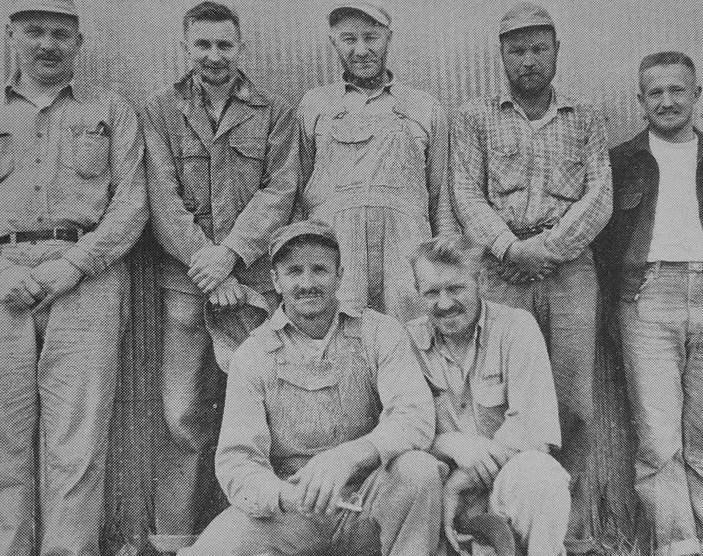 Group portrait of feed mill workers at the Farmers Elevator, New York Mills, 1959