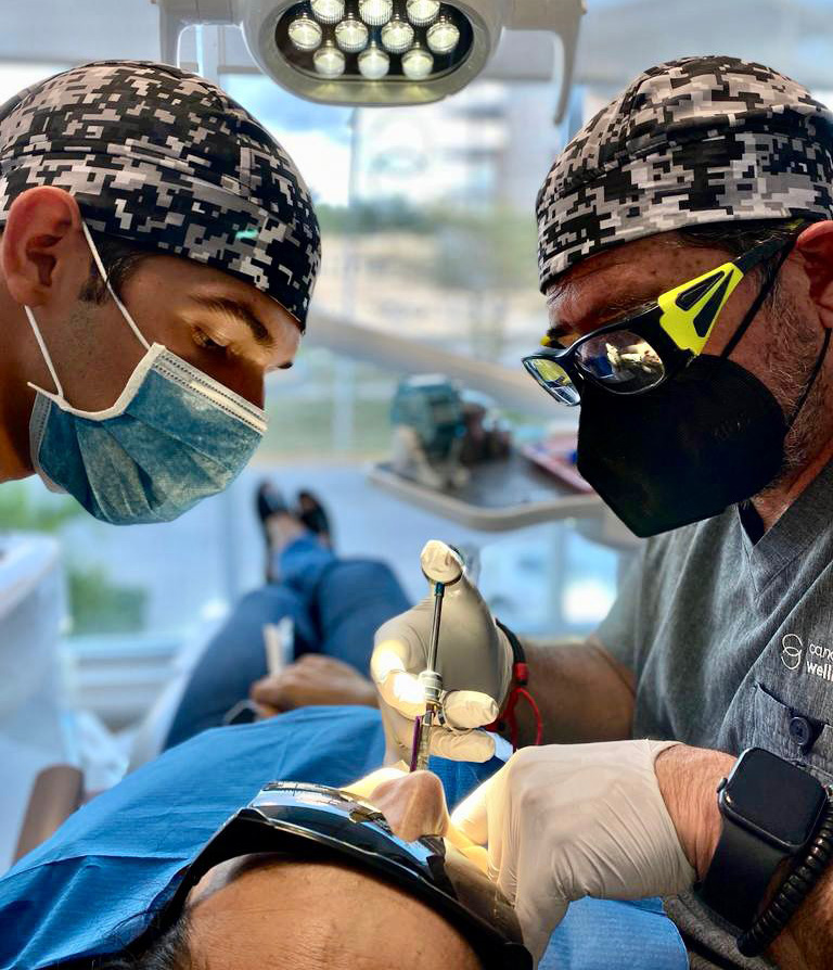 Biological dental procedure being performed using specialized tools