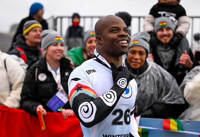 Akwasi Frimpong celebrating at an Olympic finish line