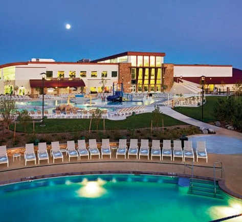VillaSport resort pool area at dusk with lounge chairs