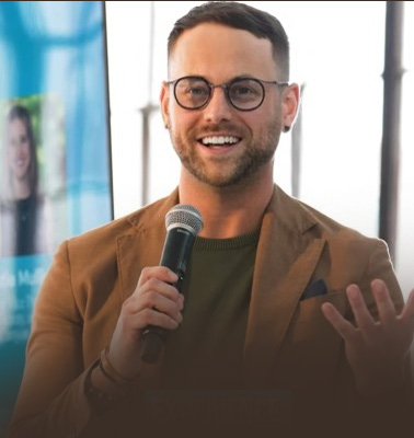 Anthony Kahler speaking into a microphone